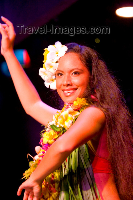 french-polynesia5: Papeete, Tahiti, French Polynesia: Tahitian woman - dancer with Plumeria flowers in her hair - photo by D.Smith - (c) Travel-Images.com - Stock Photography agency - Image Bank