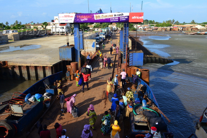 gambia71: Barra, The Gambia: ferry terminal pier - passengers leave the ferry, while trucks, mostly from Senegal, wait their turn to cross the River Gambia to Banjul - photo by M.Torres - (c) Travel-Images.com - Stock Photography agency - Image Bank