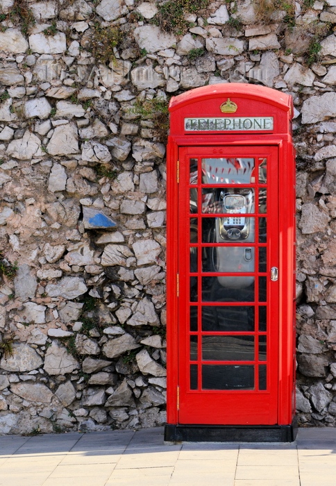 gibraltar98: Gibraltar: British phone booth at the Southport Gates - red telephone box designed by Sir Giles Gilbert Scott - K6 - photo by M.Torres - (c) Travel-Images.com - Stock Photography agency - Image Bank