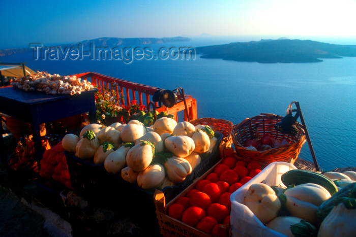 Greek islands - Santorini / Thira: fresh vegetables - view of volcanic caldera in background at sunset - photo by D.Smith
