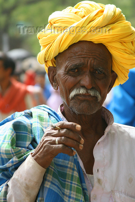 india443: Bundi, Rajasthan, India: old man wearing a yellow turban and smoking - photo by M.Wright - (c) Travel-Images.com - Stock Photography agency - Image Bank