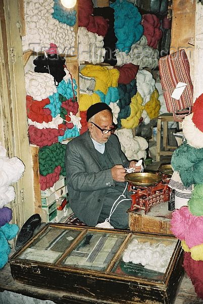 iran2: Iran - Isfahan: man in a wool shop - bazaar - photo by J.Kaman - (c) Travel-Images.com - Stock Photography agency - Image Bank