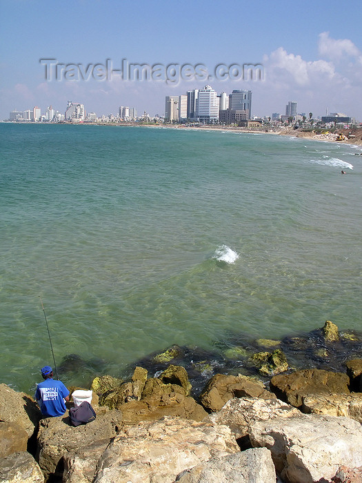 israel382: Tel Aviv, Israel: an angler in Yafo looks at the city and the Mediterranean sea - photo by E.Keren - (c) Travel-Images.com - Stock Photography agency - Image Bank