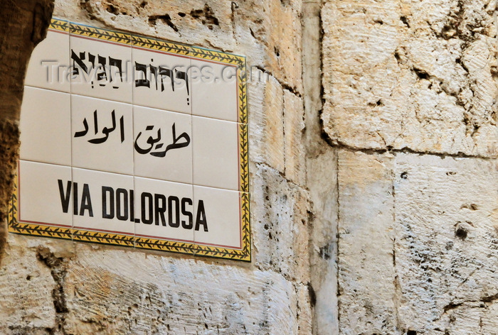 israel450: Jerusalem, Israel: street sign on Via Dolorosa, the holy path Jesus walked on his final day - sign in Hebrew, Arabic and Latin, tiles over stone ashlars - photo by M.Torres - (c) Travel-Images.com - Stock Photography agency - Image Bank