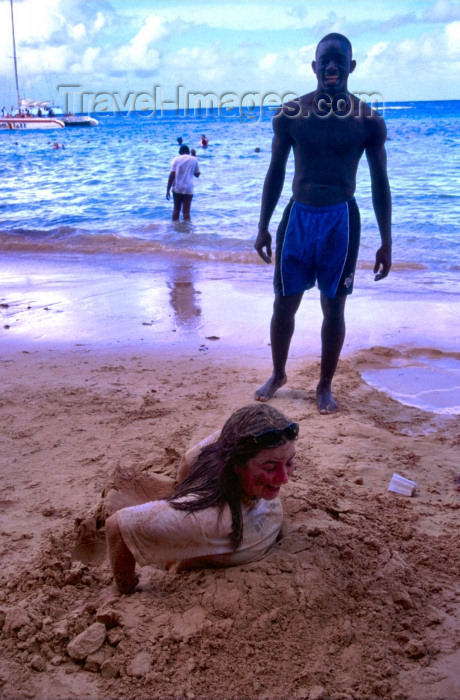 jamaica20: Jamaica - Montego Bay: girl buried in the sand (photo by Francisca Rigaud) - (c) Travel-Images.com - Stock Photography agency - Image Bank