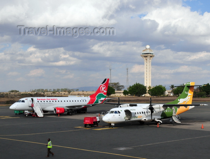 kenya78: Nairobi, Kenya: Jomo Kenyatta International Airport - control tower - 5H-PAP Udzungwa Precision Air ATR 42-320, cn 363 and 5Y-KYH Kenya Airways Embraer 170 - photo by M.Torres - (c) Travel-Images.com - Stock Photography agency - Image Bank