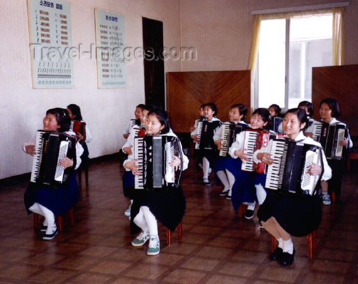 korean135: North Korea / DPRK - Pyongyang: Children's palace - accordion performance (photo by M.Torres) - (c) Travel-Images.com - Stock Photography agency - Image Bank