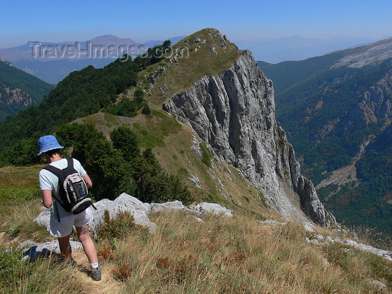 kosovo44: Kosovo - Prokletije mountains / Alpet Shqiptare - Prizren district: hiker and cliff - Dinaric Alps - photo by J.Kaman - (c) Travel-Images.com - Stock Photography agency - Image Bank