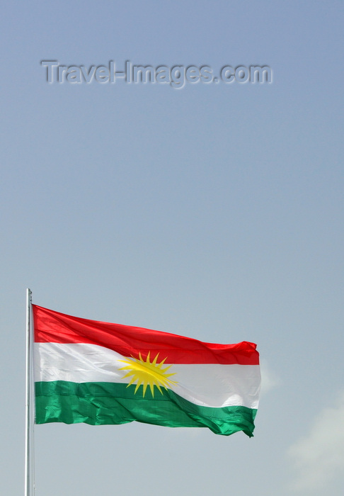 Erbil / Kurdistan, Iraq: flag Kurdistan against blue sky - Zoroastrian inspired sun disk and red, white and stripes, no crescent... - by M.Torres - Travel-Images.com