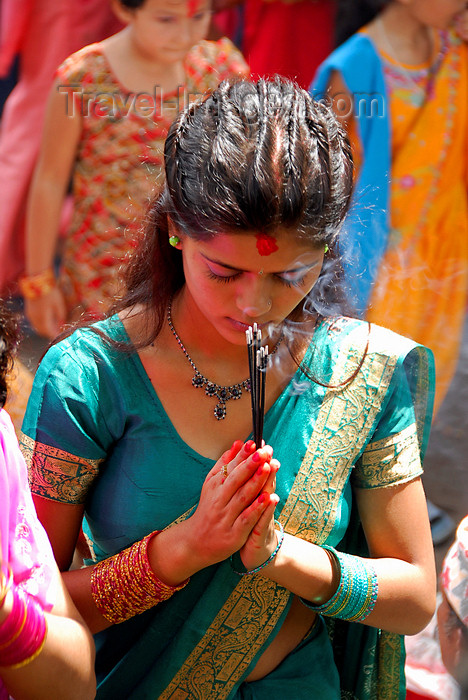 nepal203: Kathmandu, Nepal: elegant young woman praying with incense - photo by J.Pemberton - (c) Travel-Images.com - Stock Photography agency - Image Bank