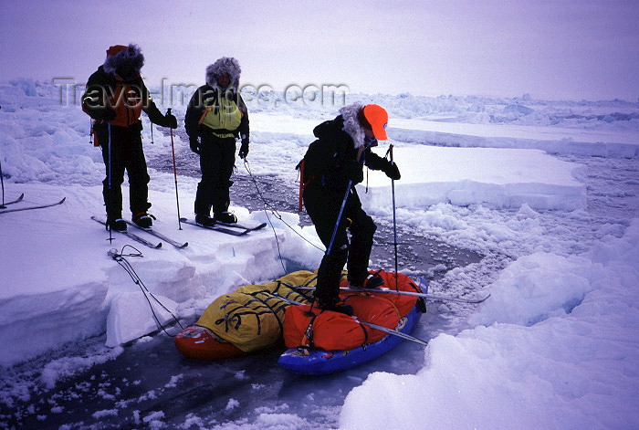 north-pole1: Arctic Ocean: crossing a narrow lead - improvised bridge (photo by Eric Philips) - (c) Travel-Images.com - Stock Photography agency - Image Bank