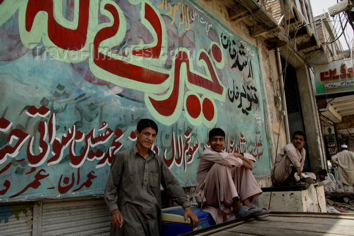 pakistan201: Peshawar, NWFP, Pakistan: mural and idle men  - photo by G.Koelman - (c) Travel-Images.com - Stock Photography agency - Image Bank