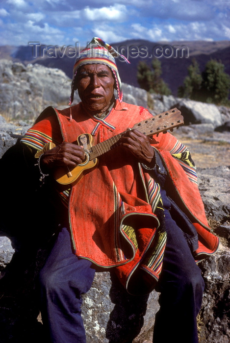 peru136: Cuzco region, Peru: old Quechua man playing guitar - Peruvian Andes - photo by C.Lovell - (c) Travel-Images.com - Stock Photography agency - Image Bank