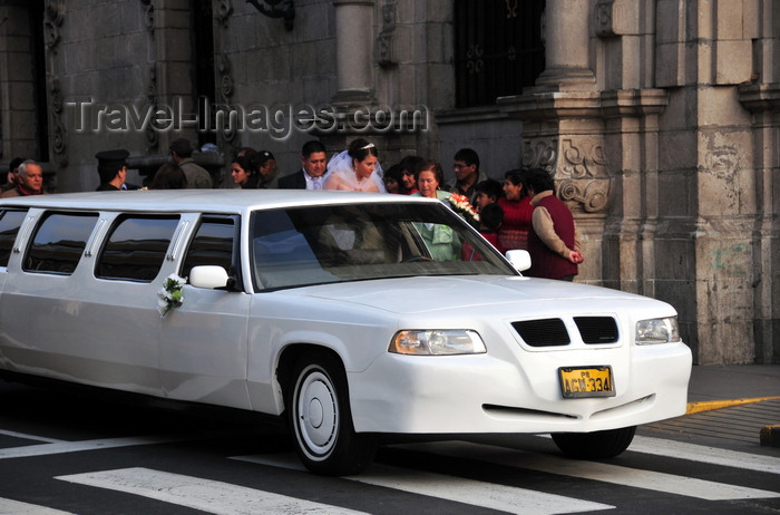 peru72: Lima, Peru: GAZ Volga limo brings a bride to her wedding - Archbishop's palace in the background - photo by M.Torres - (c) Travel-Images.com - Stock Photography agency - Image Bank