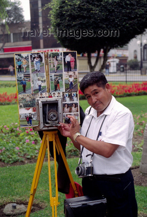 peru76: Miraflores, Lima, Peru: photographer with old time camera with photos in the main - photo by C.Lovell - (c) Travel-Images.com - Stock Photography agency - Image Bank
