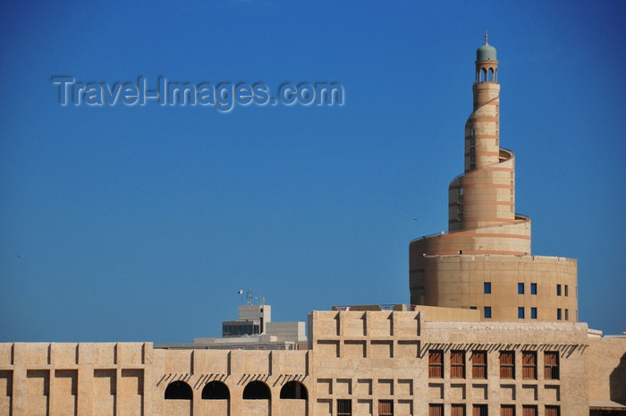 qatar24: Doha, Qatar: the spiral minaret of Qatar Islamic Cultural Center (FANAR) towers above the old buildings of Souq Waqif - photo by M.Torres - (c) Travel-Images.com - Stock Photography agency - Image Bank