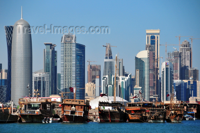 qatar33: Doha, Qatar: West Bay skyline and sterns of dhows in the dhow harbour - Burj Qatar - dhows and skyscrapers - photo by M.Torres - (c) Travel-Images.com - Stock Photography agency - Image Bank