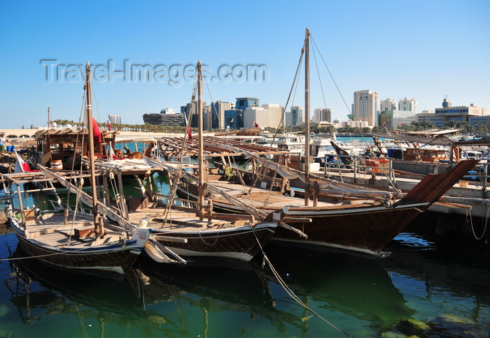 qatar46: Doha, Qatar: three dhows in the Dhow harbour - south end of the Corniche in the background, from the Ministry of Finance to the Al Hitmi Towers - photo by M.Torres - (c) Travel-Images.com - Stock Photography agency - Image Bank