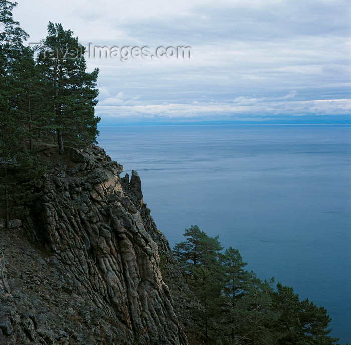 russia766: Lake Baikal, Irkutsk oblast, Siberia, Russia: pine trees and basalt rocks on the eastern shore of Olchon Island in Lake Baikal - natural sculpted cliffs - photo by A.Harries - (c) Travel-Images.com - Stock Photography agency - Image Bank