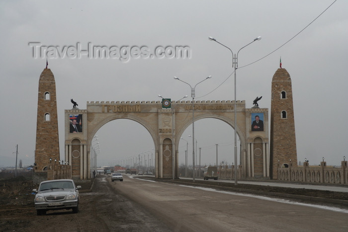 russia794: Chechnya, Russia - Grozny - city gates with posters of Putin and Kadirov Sr - GAZ Volga automobile on the left - photo by A.Bley - (c) Travel-Images.com - Stock Photography agency - Image Bank
