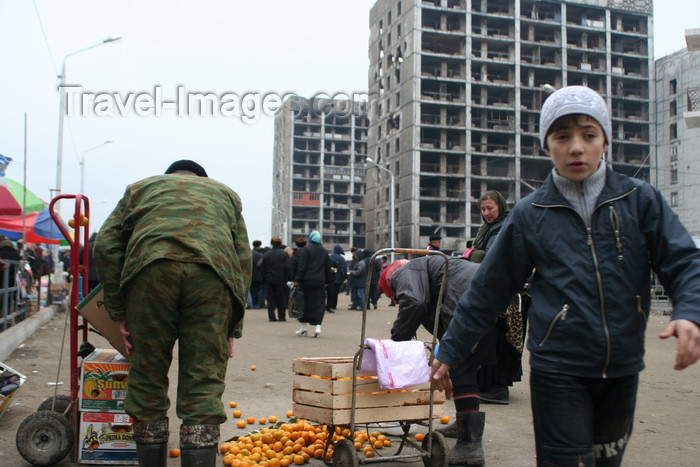 russia802: Chechnya, Russia - Grozny - market in front of destroyed buildings - tangerine stall - photo by A.Bley - (c) Travel-Images.com - Stock Photography agency - Image Bank