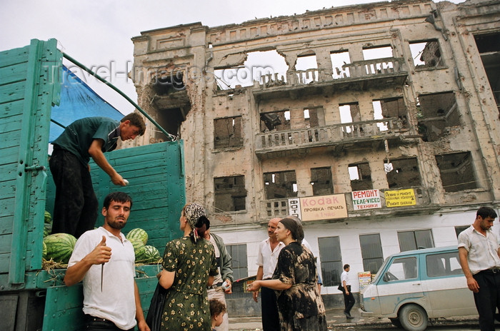 russia804: Chechnya, Russia - Grozny - men selling the watermelons from the back of a truck in front of a ruined building - photo by A.Bley - (c) Travel-Images.com - Stock Photography agency - Image Bank