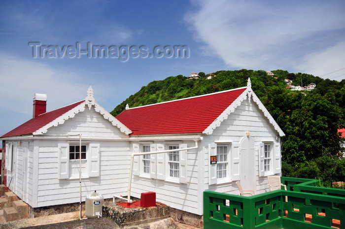 saba38: Windwardside, Saba: in this cottage you can see the pipes that connect the roofs to the underground cistern, allowing rain water to be stored - photo by M.Torres - (c) Travel-Images.com - Stock Photography agency - Image Bank
