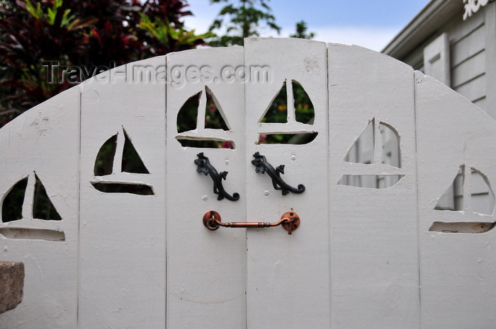 saba69: Windwardside, Saba: wooden gate with boats and lizards - Captain's Cottage - Wischusen Family - photo by M.Torres - (c) Travel-Images.com - Stock Photography agency - Image Bank