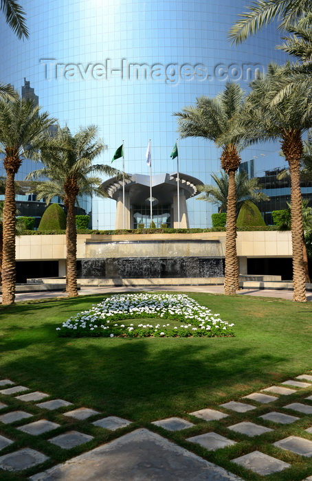saudi-arabia144: Riyadh, Saudi Arabia: Kingdom Centre skyscraper - garden with a waterfall, flowers in the shape of the tower and palm trees - view from Street 94 - photo by M.Torres - (c) Travel-Images.com - Stock Photography agency - Image Bank