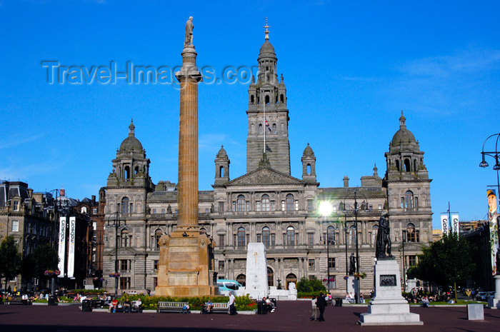 scot151: Scotland - Glasgow - George Squarein Glasgow - Robert Burns statue, nearest, the Sir Walter Scott column,and the City Chambers in the background with the sun reflecting in one of its windows - photo by C.McEachern - (c) Travel-Images.com - Stock Photography agency - Image Bank