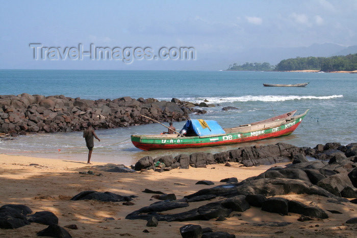 sierra-leone5: Kent, Sierra Leone: fishing boat in rocks blue sea and sky - photo by J.Britt-Green - (c) Travel-Images.com - Stock Photography agency - Image Bank