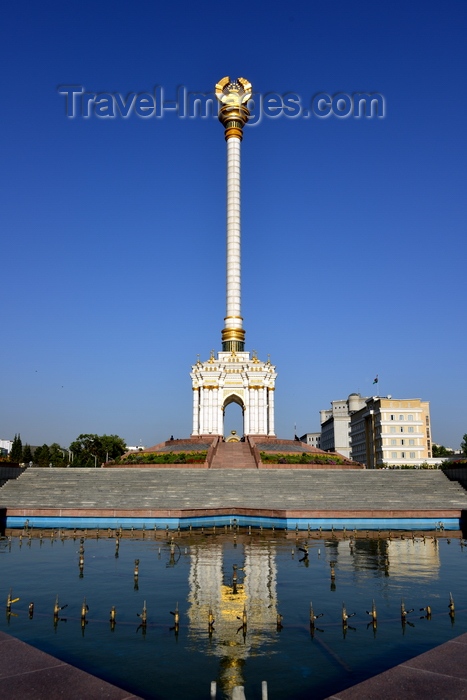 tajikistan10: Dushanbe, Tajikistan: Parchan column with the Tajikistani Tajikistani coat of arms reflected on a fountain - National Library on the right - photo by M.Torres - (c) Travel-Images.com - Stock Photography agency - Image Bank