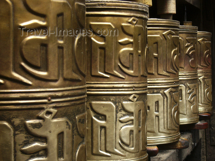 tibet18: Tibet - Lhasa: Jokhang Temple - prayer wheels - embossed hollow metal cylinders containing a scroll printed with a mantra - photo by M.Samper - (c) Travel-Images.com - Stock Photography agency - Image Bank