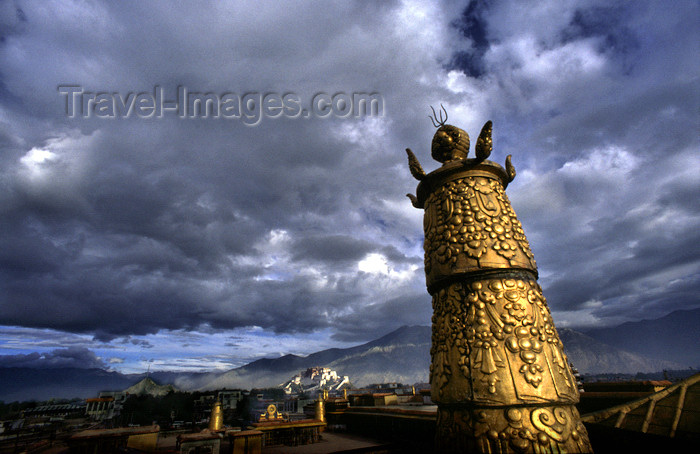 tibet74: Lhasa, Tibet: Jokhang Monastery - on the roof - gilded tower and Potala Palace - photo by Y.Xu - (c) Travel-Images.com - Stock Photography agency - Image Bank