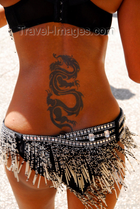 trinidad-tobago142: Port of Spain, Trinidad and Tobago: tattoo of a dragon on the back of a Trinidad girl - photo by E.Petitalot - (c) Travel-Images.com - Stock Photography agency - Image Bank