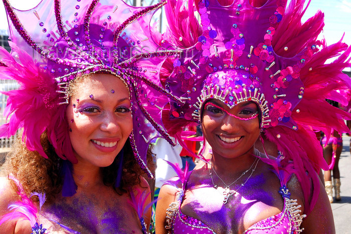 trinidad-tobago159: Port of Spain, Trinidad and Tobago: smiling girls with pink feathers - mulatto and white - carnival - photo by E.Petitalot - (c) Travel-Images.com - Stock Photography agency - Image Bank