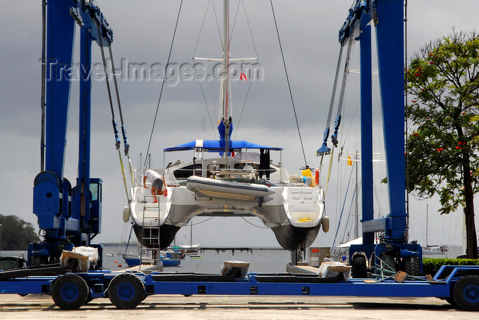 trinidad-tobago69: Port of Spain, Trinidad: taking a boat out of the water for repairs - mobile hoist and catamaran - boat handling Equipment - photo by E.Petitalot - (c) Travel-Images.com - Stock Photography agency - Image Bank