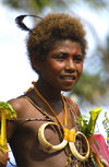 PNG - Papua New Guinea - Young boy with pig tusk necklace, Tuam Island - photo by B.Cain
