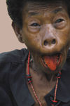 PNG - Papua New Guinea - Woman Grimacing, beetlenut stained tongue, KitavaIsland (photo by B.Cain)