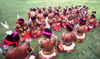 PNG - Papua New Guinea - Group of sitting female preformers, Kitava Island (photo by B.Cain)