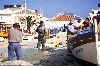 Portugal - Algarve - Armacao de Pera (Concelho de Silves): pescadores limpando redes (barco Maria Otilia) - photo by T.Purbrook