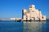 Doha, Qatar: dhow near the Museum of Islamic Art - cereal silos in the background - photo by M.Torres