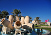 Doha, Qatar: Water Pots fountain, Al Corniche - Museum of Islamic Art in the background - photo by M.Torres