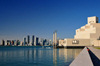 Doha, Qatar: Museum of Islamic Art and the West Bay skyscrapers - photo by M.Torres