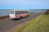 Anse Tamarin, Rodrigues island, Mauritius: local bus on the coastal road - left-hand traffic common in former British colonies - photo by M.Torres