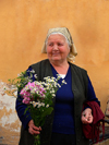 Sighetu Marmatiei, Maramures county, Transylvania, Romania: woman with flowers at the local market - photo by J.Kaman