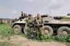 Chechnya, Russia - Chechen warriors pose near a Russian APC destroyed in Chechnya war - photo by A.Bley