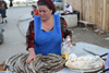 Chechnya, Russia - Grozny - Chechen woman in market sells traditional Chechen dish - sausages - photo by A.Bley
