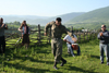 Chechnya, Russia - man in uniform dances traditional Chechen dance in meadow - photo by A.Bley