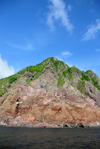 Saba: volcanic scarps seen from the sea - coastal view - photo by M.Torres